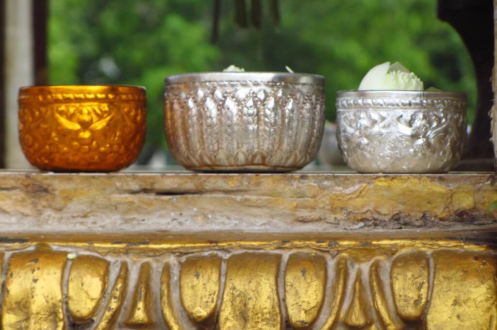 Three bowls sitting on a ledge at a temple. Phnom Penh, Cambodia. 