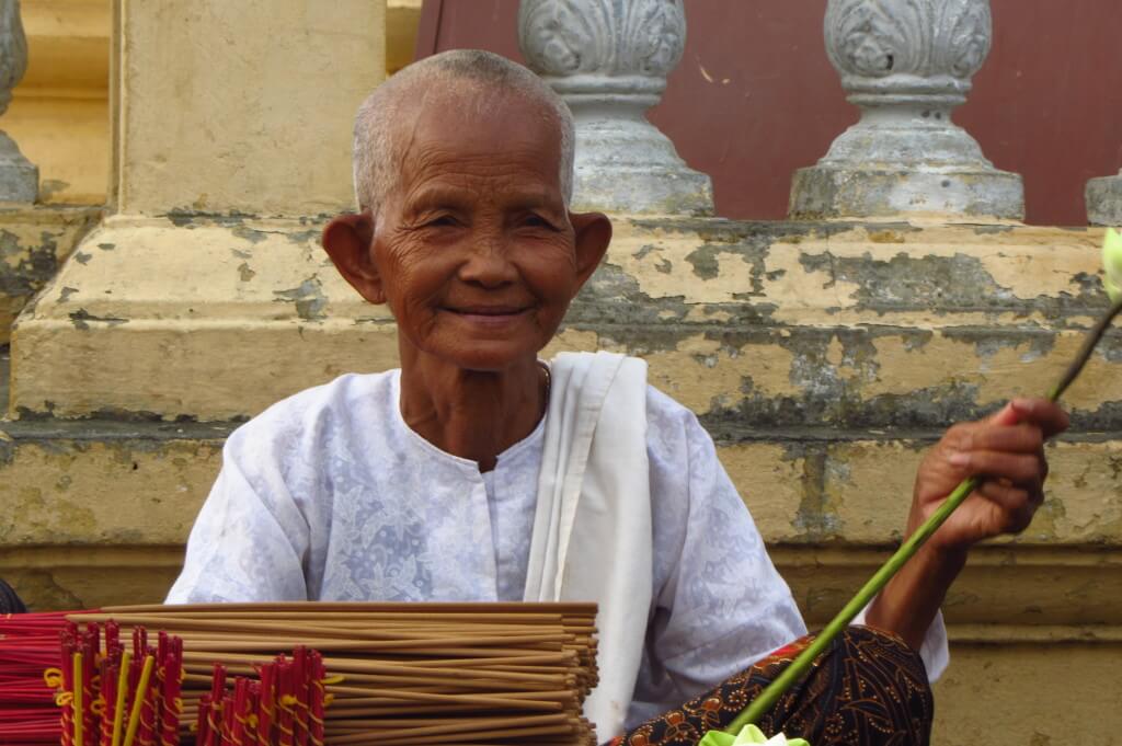 This lovely monk was sitting outside a temple. When I asked her if I could take her picture in Khmer, she happily obliged. Phnom Penh, Cambodia. 