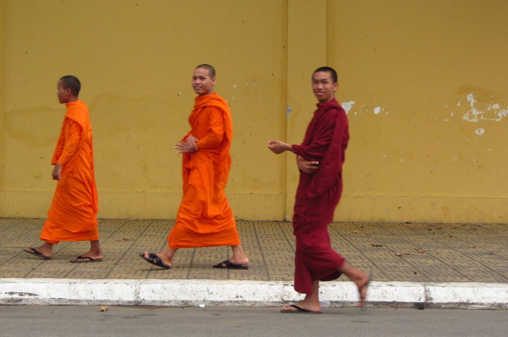 I saw monks walking my way off in the distance and waited in front of this bright yellow wall for them to walk by. Phnom Penh, Cambodia.