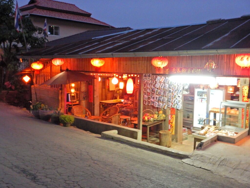 Mae Salong in Northern Thailand a Yunnan style Chinese restaurant with red lanterns. Tea leaves are drying on the rooftop. 