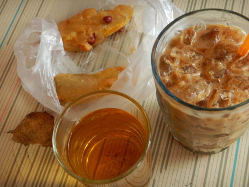 Mae Salong in Northern Thailand deep fried peanut snacks, iced sweet tea and oolong tea