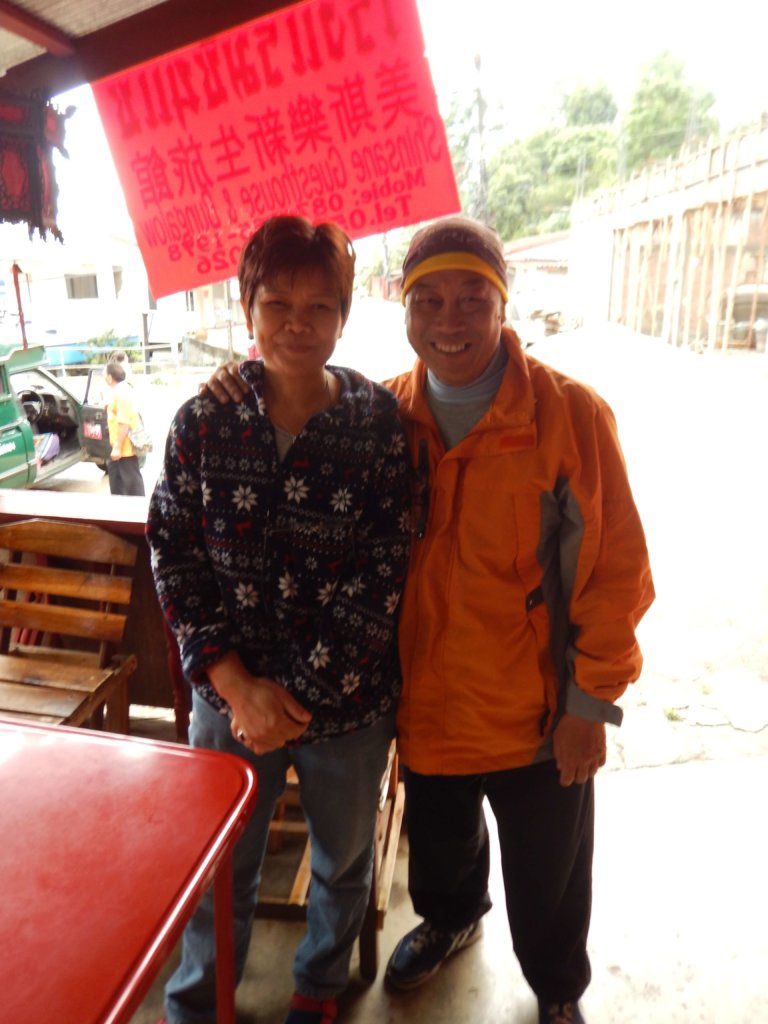 Mae Salong in Northern Thailand two members of the staff at the guesthouse smiling at the camera