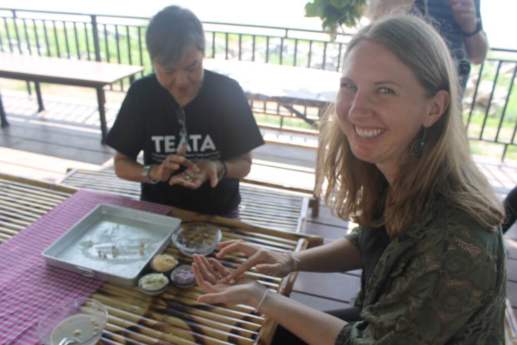 Jen making Bua Loy in Nakhon Phanom, Thailand by Two Can Travel