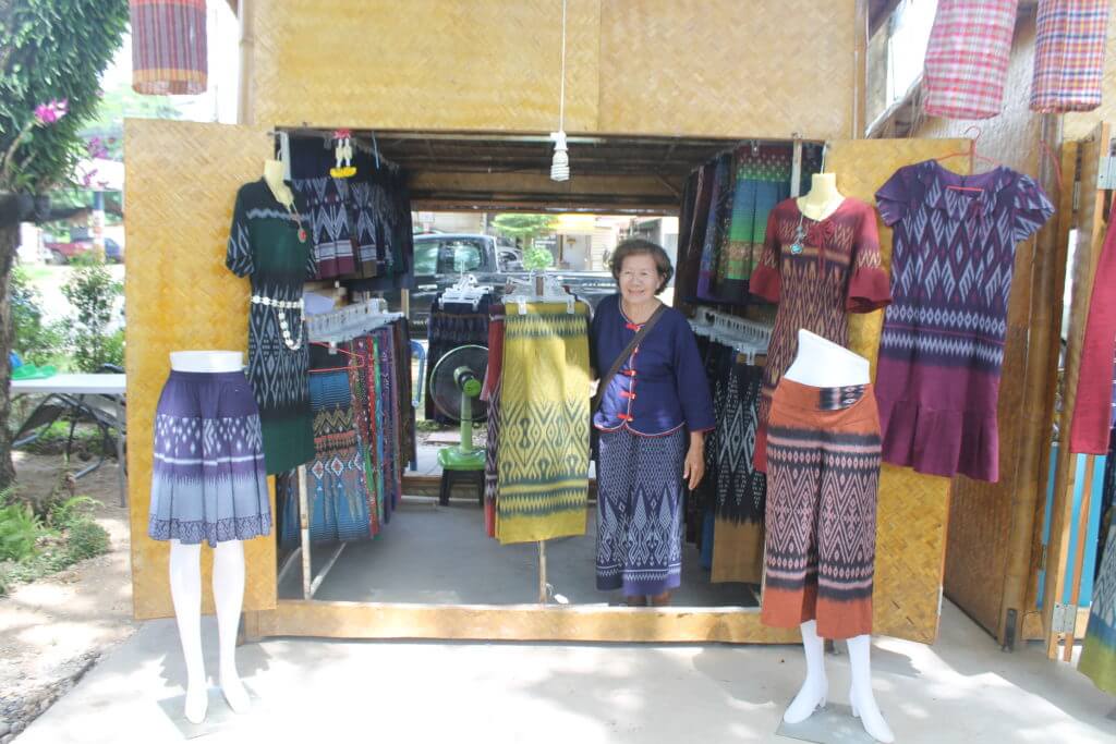 A lovely seller at the Sun Tree Art & Culture Organic Market in Nakhon Phanom, Thailand by Two Can Travel