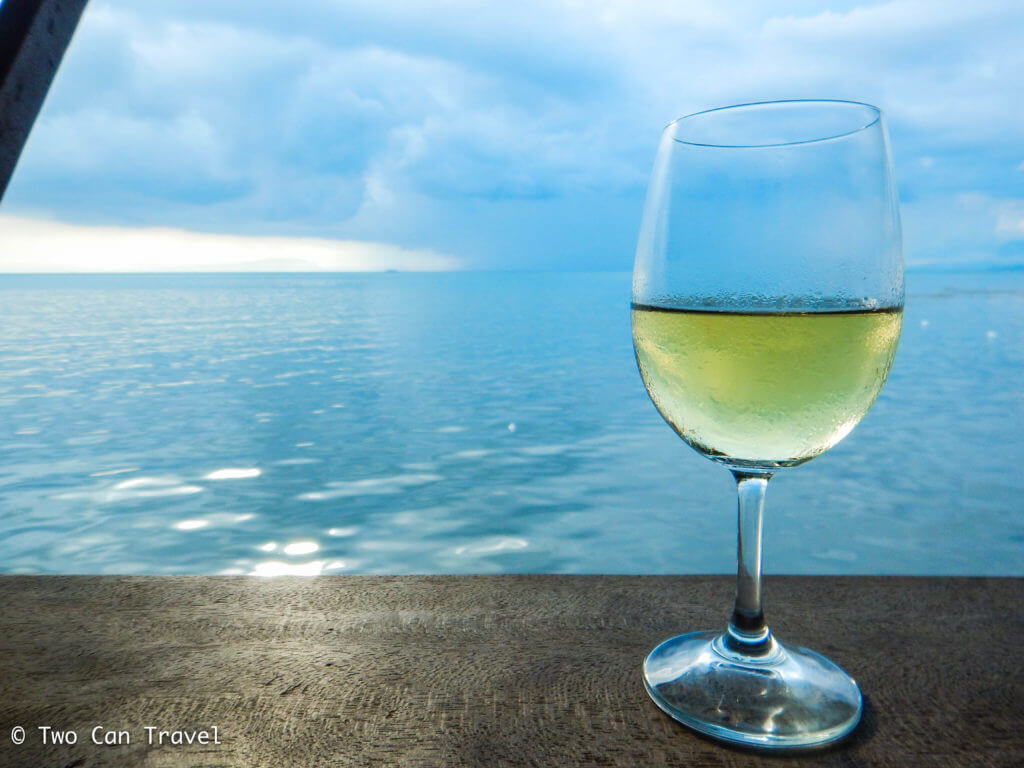 Drinking wine and watching an incoming storm during rainy season in Kep Cambodia.