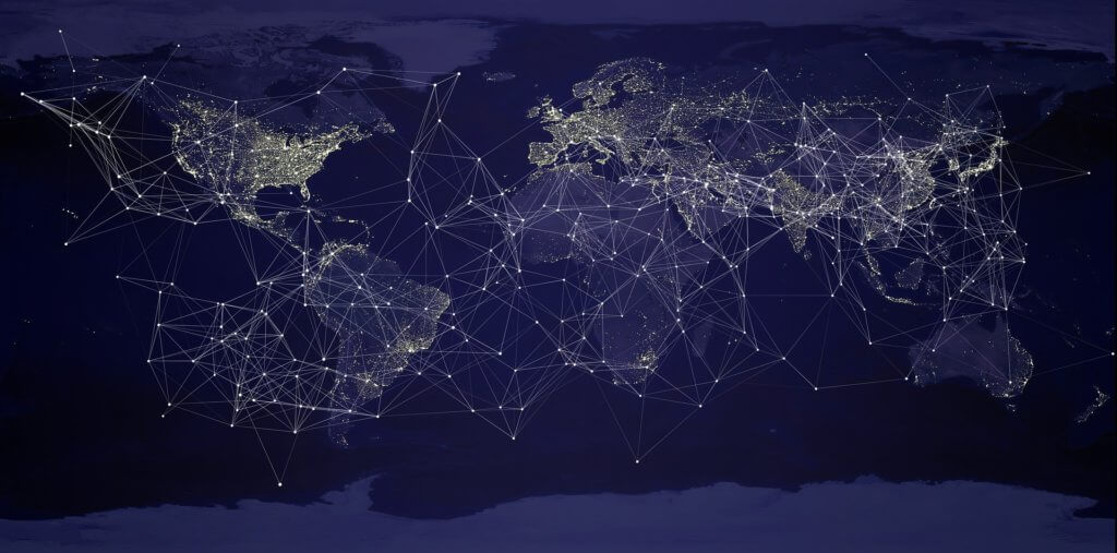 How to Become a Digital Nomad. Your Ultimate Guide to starting Digital Nomad life. An image of the world at night with lights connecting cities. 