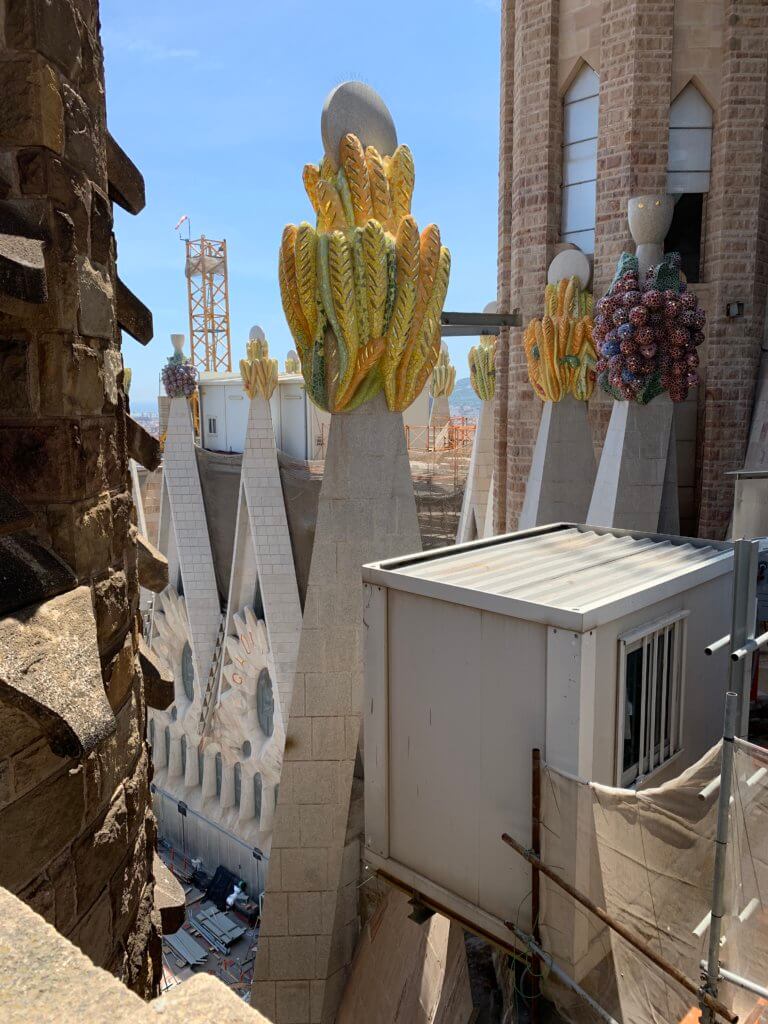 Gaudi Buildings in Barcelona A close up look at the fruits and vegetables on top of the spires on Sagrada Familia 