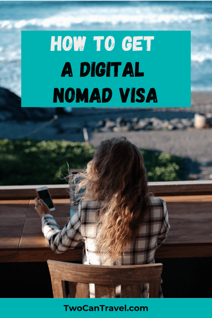 Digital Nomad Visa remote work visa a woman is sitting in front of the ocean at a table with her laptop and phone. 